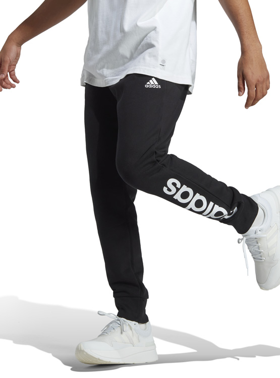 PANTALÓN DE BUZO ADIDAS ESSENTIALS PIERNA CÓNICA LOGO - 6